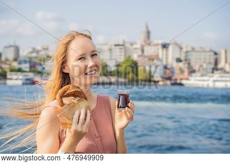 Woman In Istanbul Having Breakfast With Simit And A Glass Of Turkish Tea. Glass Of Turkish Tea And B