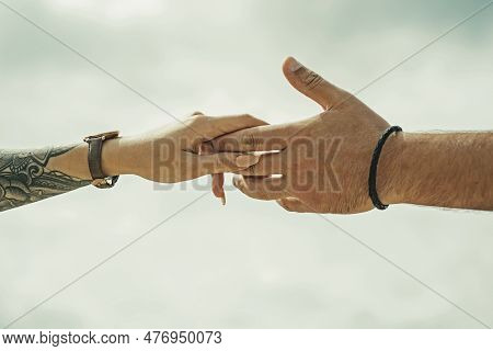 Couple Hands With Tattoo. Helping Hand. Holding Hand, Close Up. Giving A Help Hand. Rescue, Helping 