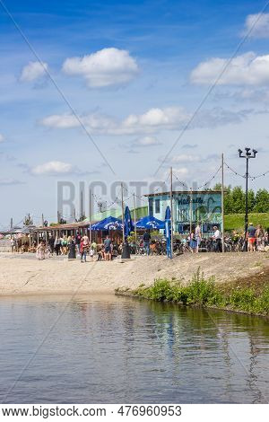 Harderwijk, Netherlands - May 22, 2022: People Enjoying The Spring Weather At The Beach In Harderwij