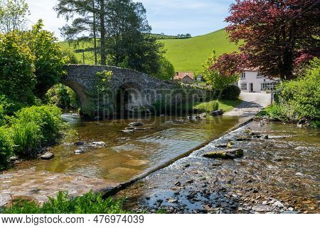 The Badgworthy Water River Flowing Under Malmsmead Bridge In Exmoor National Park