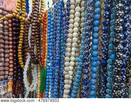 Plastic Rosary Market View. Colorful Plastic Rosaries Close Up Shot In The Market. Religious Beads W