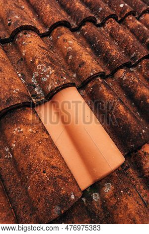 Single New Clay Roof Tile On Old Rustic Terracotta Roofing As Background, Architectural Detail From 