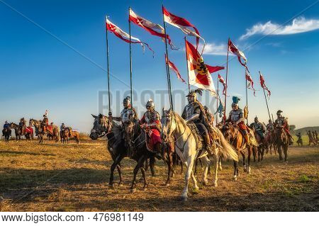 Gniew, Poland, Aug 2020 Polish Hussars Riding On Horses And Carrying Emblems And Flags, Heavy Cavalr