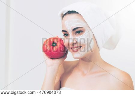 Beautiful Woman Having A Facial Mask Treatment With Tomato Cream Extract Showing Benefit Of Nature T
