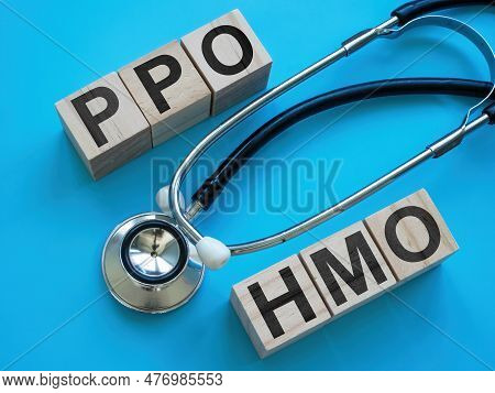 Wooden Cubes With Letters Ppo And Hmo Near A Stethoscope.