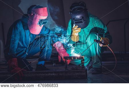 Metal Welding Steel Works Using Electric Arc Welding Machine To Weld Steel At Factory. Metalwork Man