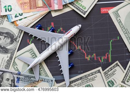 Toy Plane On Euro Cash Background, Travel With Airplane. Conceptual Image Of The Price Of Airline Ti