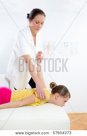 Femile Chiropractor doing adjustment on female patient