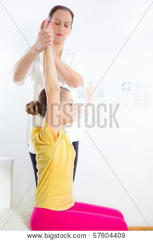 Chiropractor doing adjustment on female patient