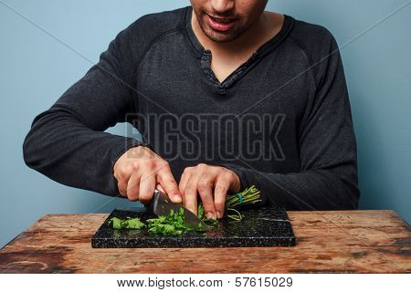 Man Chopping Herbs
