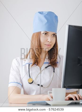 Doctor Looks At A Computer Monitor