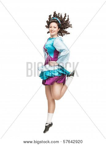 Young Woman In Irish Dance Dress Dancing Isolated