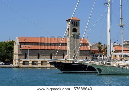 Rhodes Island Landmark, Mandraki Port, Greece. The Historical Port Is Still Used Today As A Marina B