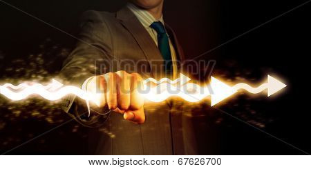 Businessman holding lightning in fist. Power and control