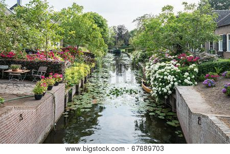Herengracht Canal With Historic Houses In The Dutch Village Of Drimmelen