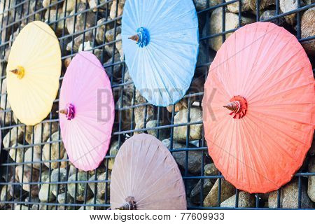Brick Wall Decorated With Umbrellas