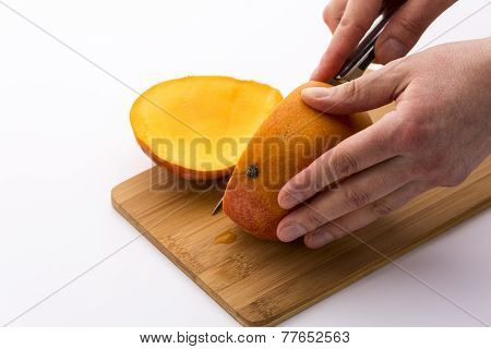 Third Of A Mango Sliced Off In A First Cut