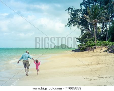 Girl And Grandad At The Beach