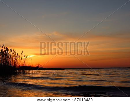 sunset at coast of the lake