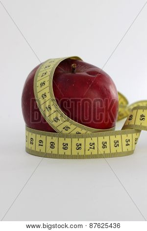 Metre-stick and apple