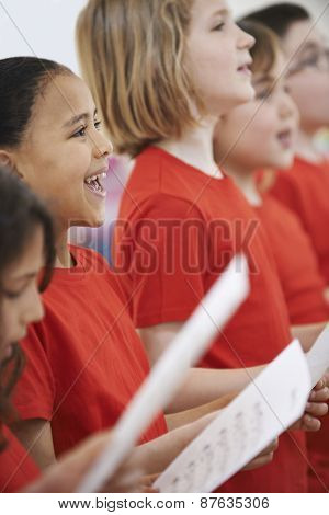 Group Of Children Singing In Choir Together