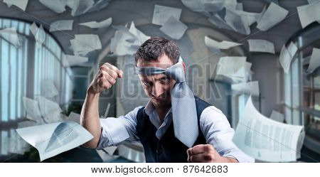 Fighting businessman with a tie on his head