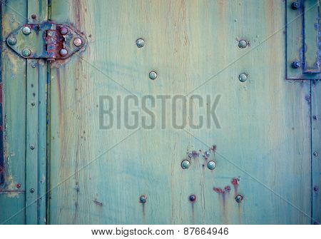 Background with Faded green chipped paint and hinge