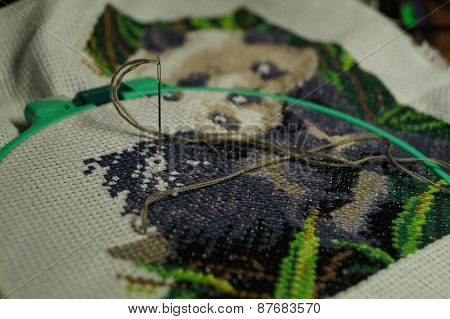 Embroidery of a picture strings of a mouline thread
