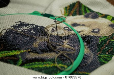 Embroidery of a picture strings of a mouline thread