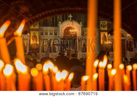 ATHENS, GREECE - APR 12, 2015: Unknown people during celebration of Orthodox Easter (Midnight Office of Pascha) Holy Saturday is often the only time that the Midnight Office will be read in parishes.