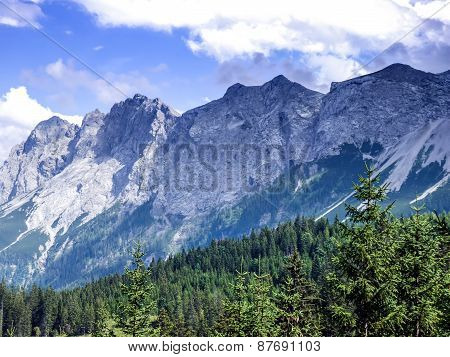 Alpine Landscape: The View Over The Green Valley, Mountains And The Sky In Alps In Austria