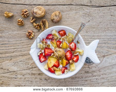 A Bowl Of Fruit, Walnuts And Yogurt