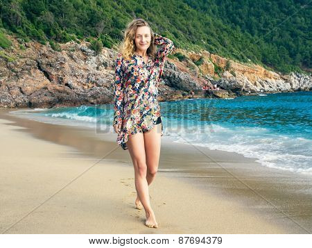 A Girl Walking Along The Beach