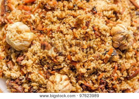 Plov, National Uzbek Spicy Meal With Meat, Rice, Onion And Garlic