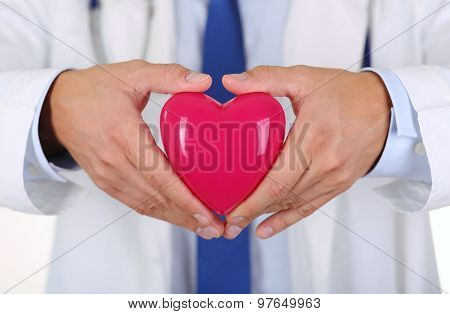 Male Medicine Doctor Hands Holding Red Toy Heart