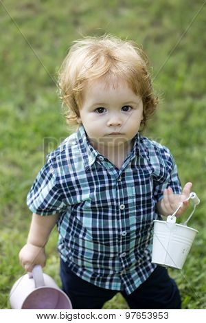 Small Boy With Watering-can And Bucket