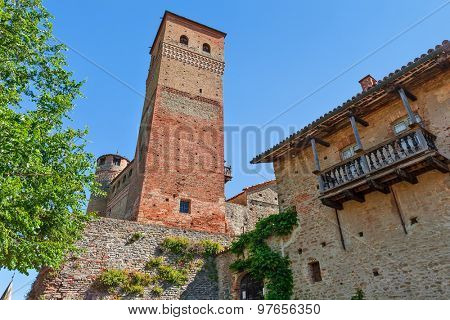Old medieval tower under blue sky in Serralunga d'Alba in Piedmont, Northern Italy.