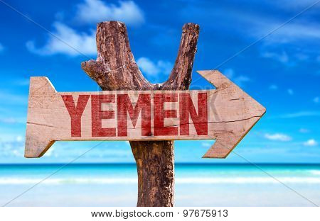 Yemen wooden sign with coast background