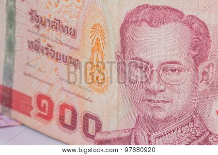 Close Up Of Thailand Currency, Thai Baht With The Images Of Thailand King. Denomination Of 100 Bahts