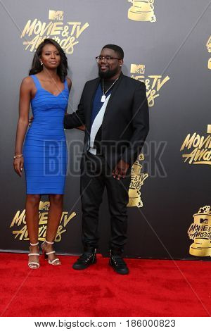 LOS ANGELES - MAY 7:  Brittany Marie Batchelder, Lil Rel Howery at the MTV Movie and Television Awards on the Shrine Auditorium on May 7, 2017 in Los Angeles, CA