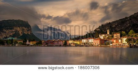 Torbole coast at Garda Lake with mountains in background Italy
