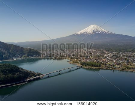 Mountain Fuji reflected in Kawaguchiko lake on a sunny day and clear sky, Yamanashi Japan