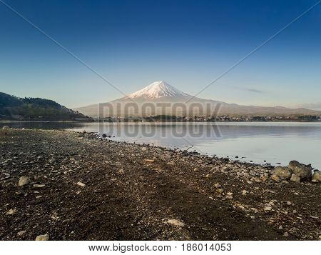 Mountain Fuji reflected in Kawaguchiko lake on a sunny day and clear sky, Yamanashi Japan