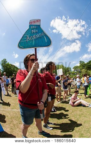 ATLANTA, GA - APRIL 22:  A woman holds up a sign that says 
