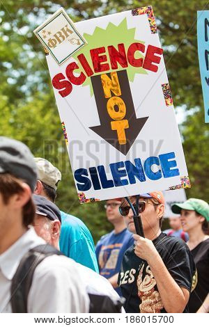 ATLANTA, GA - APRIL 22:  A woman holds up a sign that says 