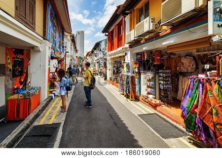 Tourists Walking Along Gift Shops At Haji Lane In Singapore