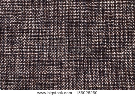 Brown and black background with wicker pattern closeup. Structure of the dark umber fabric with natural texture. Cloth backdrop.