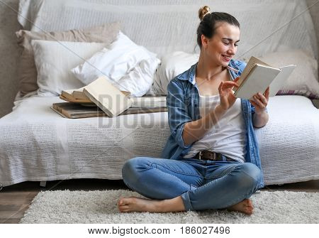 Girl Reading A Book In A Cozy Room