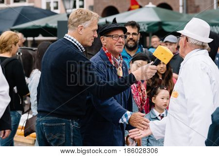 Gouda Netherlands - August 4 2016: Gouda Cheese Market. It remains a spectacle at the heart of Holland's cheese industry with its rituals and Dutch traditions now a must-see attraction.