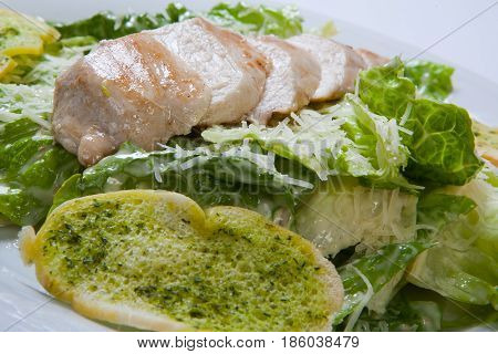 Caesar Salad Plate With Cheese And Garlic Bread